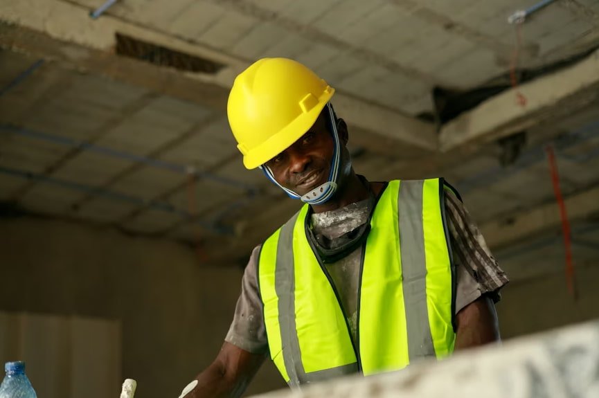Construction manager reviewing plans on site